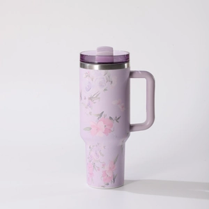Detail showing high-capacity purple thermal mug with 3D floral pattern and sturdy handle