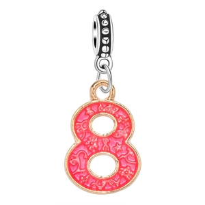 Detailed macro view of pink enamel number 8 charm with gold edging and textured silver bail