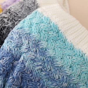 Blue gradient cable knit kids winter hat with thick texture and white trim detail