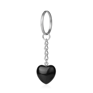 Polished black heart-shaped natural stone pendant on a silver metal keychain