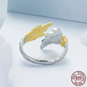 Adjustable S925 sterling silver wing ring with 14K gold accents and feather textures