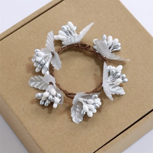 Silver and white artificial berry napkin ring for festive Christmas table setting decor