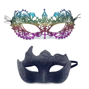 Detail of colorful lace phoenix mask and black glitter masquerade mask on white background