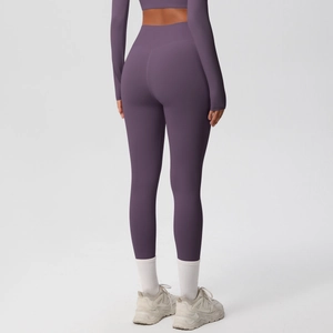Rear view of high-waisted dark purple yoga pants featuring soft brushed fabric texture