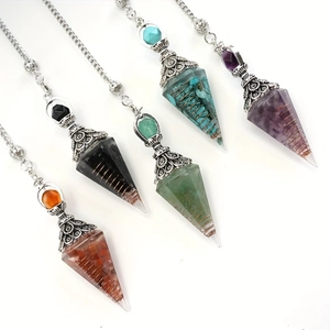 Five assorted resin pyramid dowsing pendants with healing crystals and metal coils