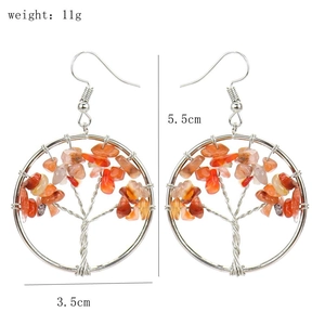 Detailed view of handmade tree of life earrings with orange stones, size 5.5cm x 3.5cm