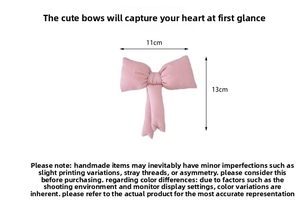 Pink quilted bow storage pouch showing dimensions of 11cm width and 13cm height