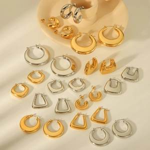 Collection of modern 18K gold and silver chunky stainless steel hoop earrings for women