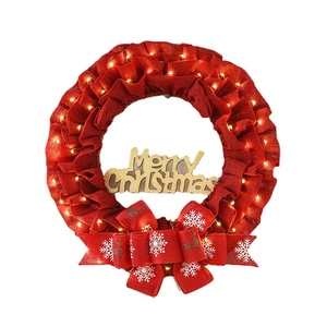 Christmas linen wreath with red bow, LED lights and Merry Christmas wooden sign