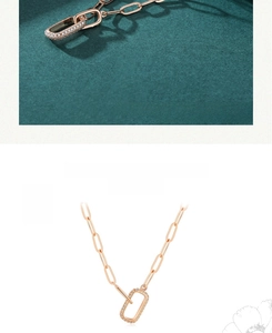 Detailed view of a rose gold paperclip chain necklace with a pave rectangular pendant