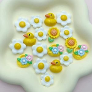 Colorful resin charms set featuring cartoon ducks, sunflowers and baskets for DIY crafts