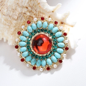 Retro bohemian round brooch with blue stones, green crystals and pearls on gold base