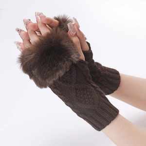Close-up of brown knit fingerless gloves featuring soft faux fur cuffs and cable texture