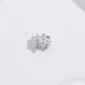 Macro detail of S925 sterling silver star bead with sparkling pavé zircon stones