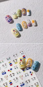 Detail view of cartoon facial expression nail stickers with 3D gold stamping finish