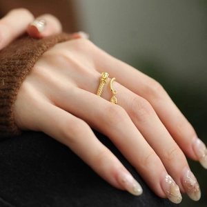 Golden dragon ring in S925 sterling silver with texture and a delicate leaf pendant