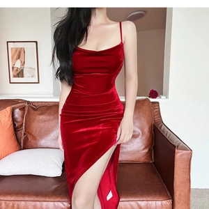 Detail of burgundy velvet dress featuring elegant side slit and refined waist ruching