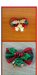 Close-up of festive plaid Christmas bows with gold leaves and double metal bells