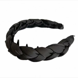 Detail of black satin padded headband featuring anti-slip teeth for high skull top hair style
