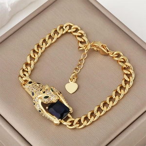 Hip hop Cuban link bracelet with gold leopard head holding a black gemstone pendant