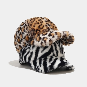 Detailed view of leopard and zebra print faux fur baseball caps for winter warmth