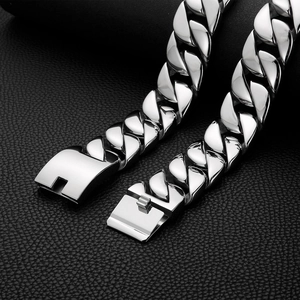 Polished 31mm thick stainless steel Cuban link chain with secure clasp on leather