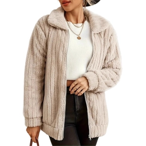 Detail of oatmeal faux fur jacket showing striped fleece texture and sturdy zipper closure