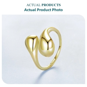 Macro detail of S925 sterling silver stamp on dual teardrop open ring with gold finish
