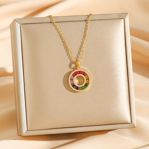 18K gold plated colorful zircon donut necklace with sparkling crystals on silk background