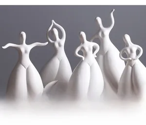 Detailed view of matte white ceramic figurine showing the elegant abstract curves and finish