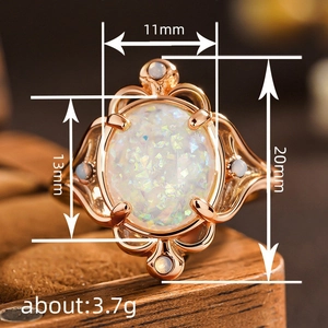 Vintage rose gold ring with large oval white opal and delicate filigree detailing