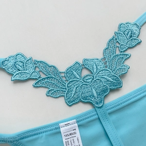Light blue floral lace embroidery thong for women with intricate texture detail