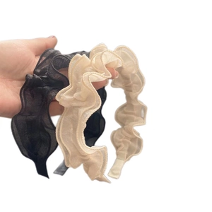 Elegant ruffled mesh headbands in black and beige with a wavy pleated texture