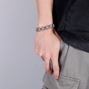 Punk style stainless steel cross bracelet for men with vintage silver finish on wrist