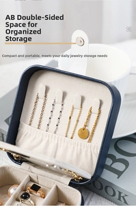 Dual-layer jewelry box interior showing necklace hooks and ring storage slots