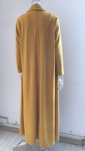 Detail view of mustard yellow knit cardigan back with long length and ribbed texture