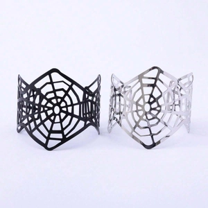 Gothic punk black and silver metal spider web wide cuff bracelets on white background