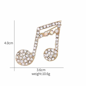 Detailed view of luxury musical note brooch with sparkling crystals and AB rhinestones