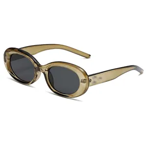 Retro oversized cat eye sunglasses with brown translucent frames and dark grey lenses