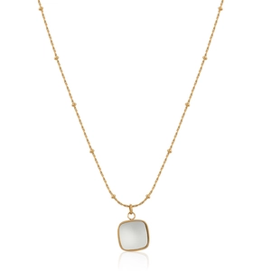 Macro shot of square mother-of-pearl pendant on gold satellite chain necklace