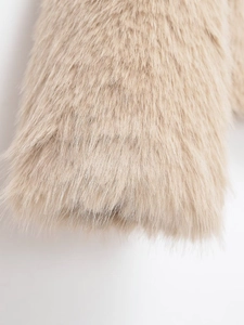 Close-up of beige faux fur texture showing high fiber density and soft plush material
