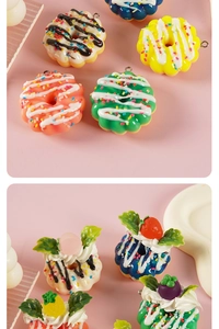 Detailed close-up of colorful artificial donuts and dessert keychains on pink background