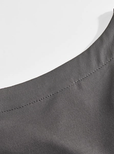 Detailed macro view of dark gray stretch fabric with high-quality stitching on Men's T-shirt