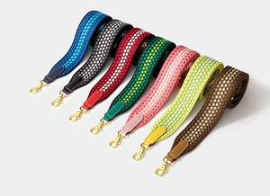 Selection of wide woven nylon replacement straps with leather ends and gold metal buckles