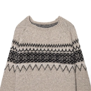 Beige Fair Isle knit sweater with black geometric pattern and fuzzy mohair texture