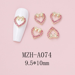 Pink heart-shaped nail charm with gold bow and rhinestones, sized 9.5x10mm for DIY nail art