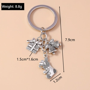 Detailed view of silver Christmas keychain with dimensions for gift box and stocking charms