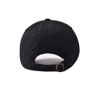 Close-up of the adjustable back metal buckle on this black cotton baseball cap