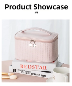 Detailed view of pink quilted PU leather makeup bag with dual metal zippers and top handle