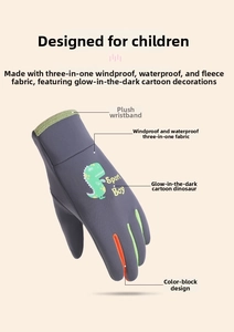 Detail view of children's ski gloves with waterproof fabric and glow-in-the-dark dinosaur